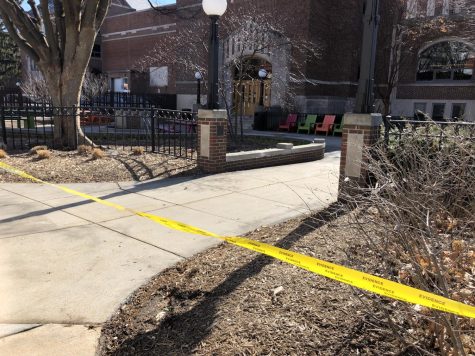 Yellow caution tape blocks off the scene of a shooting at Michigan State University.