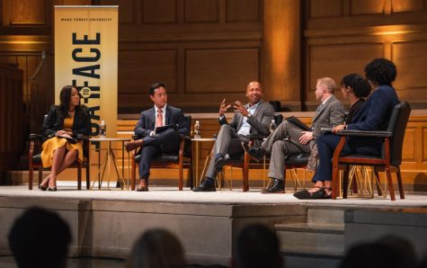 Bryan Stevenson speaks with five panelists during a students-only event in Wait Chapel.