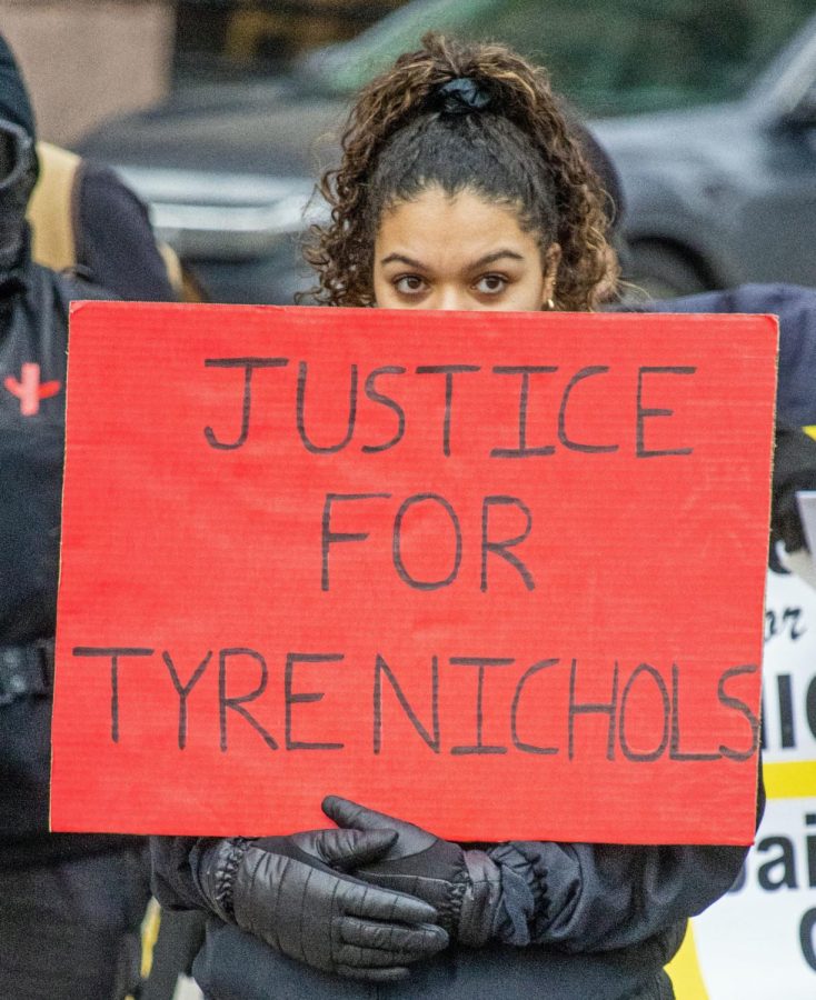 A protestor at the Ohio State House holds a sign that reads Justice for Tyre Nichols.