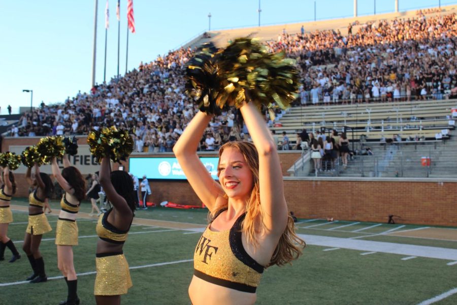Emily Reeves cheers on the Demon Deacons at Truist Field.