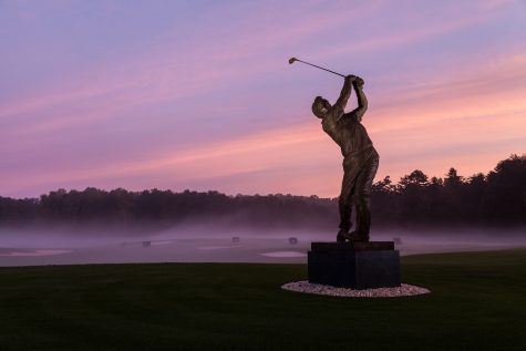 A statue of golf legend Arnold Palmer stands outside the Arnold Palmer Golf Complex on the campus of Wake Forest University on Tuesday, October 15, 2013.