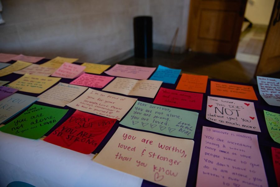 Notes of encouragement to survivors are displayed at the Safe Office Crew's March 30 Speak Out event.