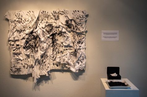 This piece, titled “Patchworked Identities,” invites viewers to add their charcoal handprint
onto the canvas, which is made of recycled cloth as a criticism of the fast-fashion industry.