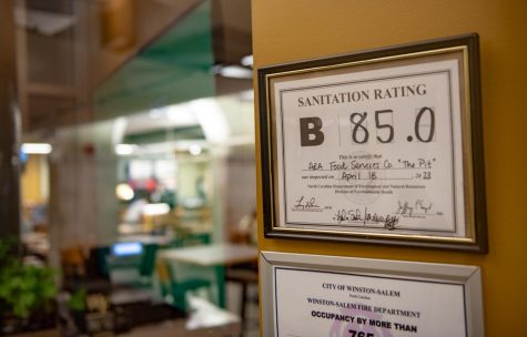 A sign hanging in the Pit Wednesday night shows a B rating and a score of 85. The Pit has since been reinspected and earned a grade of 91.5. 