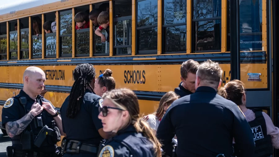 Police+surround+a+school+bus+after+a+shooting+at+the+Covenant+School+in+Nashville%2C+Tenn.