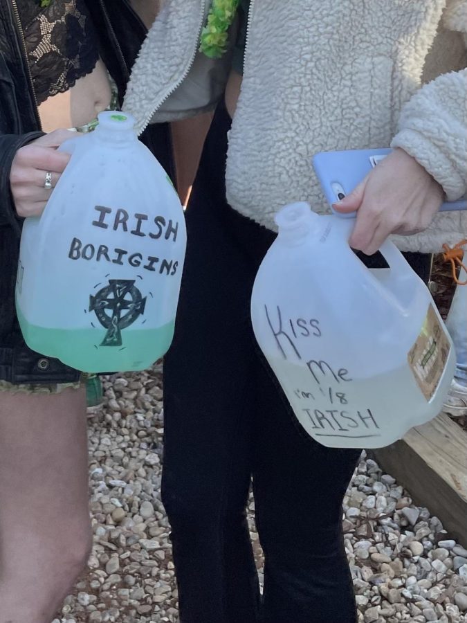 Two Wake Forest students hold Black Out Rage Gallons, or BORGs, at a party.