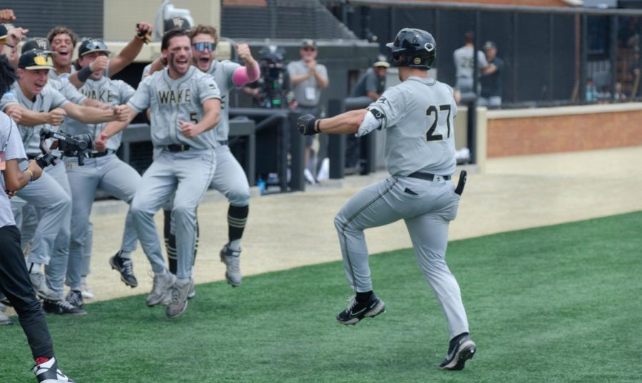 The+Demon+Deacons+celebrate+after+a+Bennett+Lee+solo+home+run.
