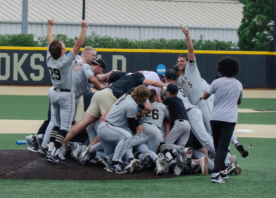 The Wake Forest baseball team celebrates on the mound after defeating Alabama in the Super Regionals.