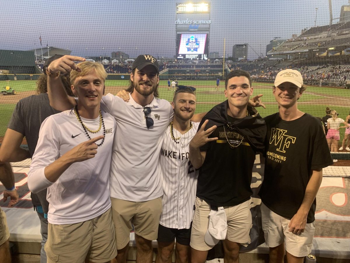 Tyler Hines (center) poses with friends at the Mens College World Series. (Courtesy of Tyler Hines)