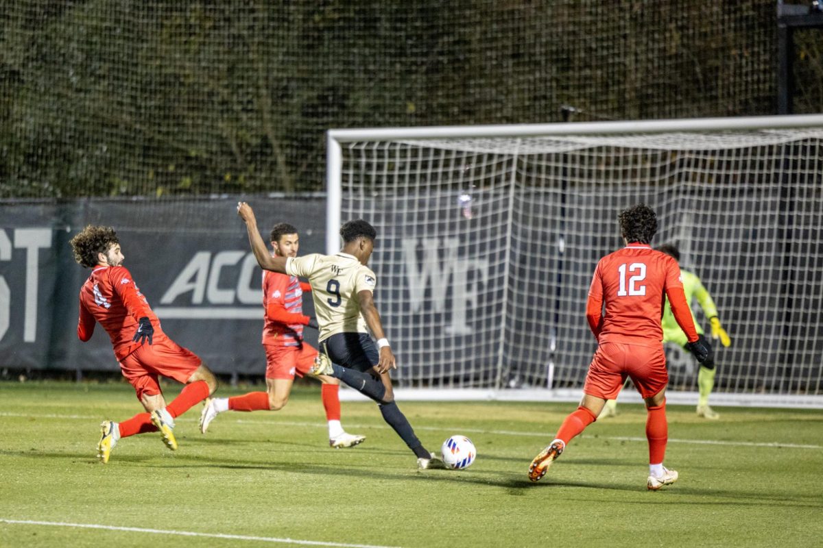 Junior striker Roald Mitchell shoots the ball during an NCAA tournament match against Ohio State. 
