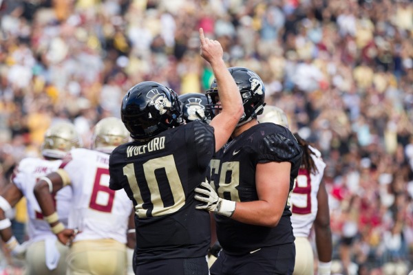 Then-Wake Forest QB John Wofford celebrates with his team when the Demon Deacons and Georgia Tech last met in 2017.