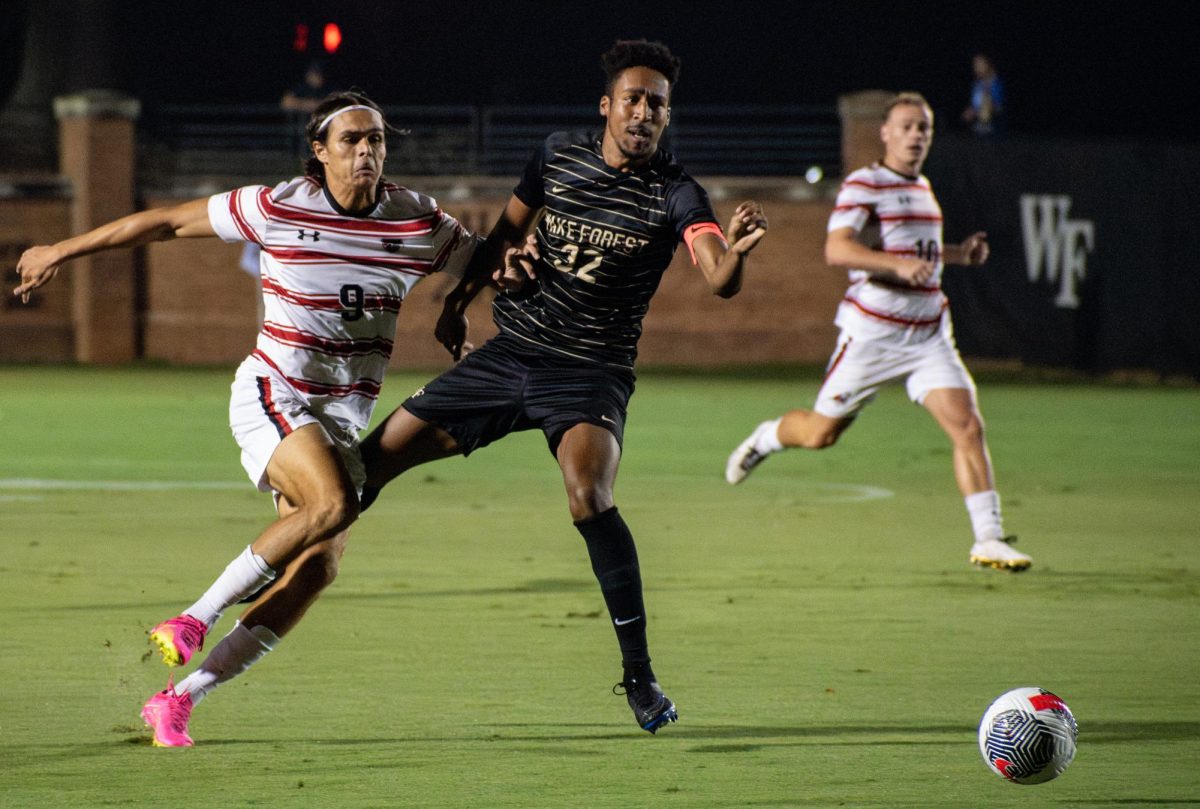 Senior+defender+Garrison+Tubbs+fights+for+positioning+with+a+Gardner-Webb+player+on+Tuesday%2C+Sept.+12.%0A