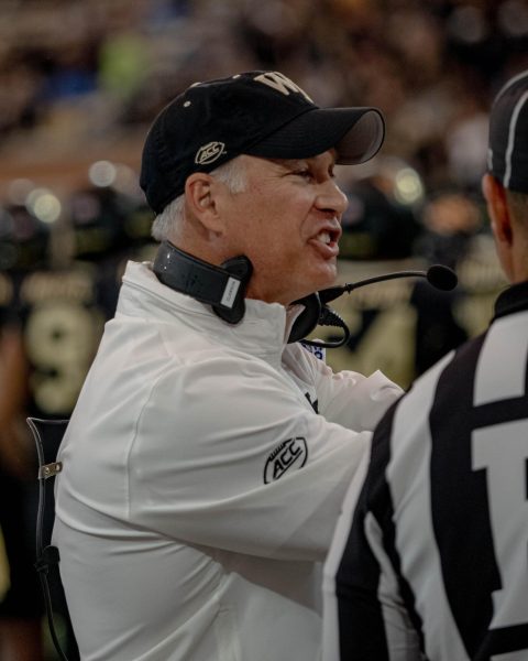 Head Coach Dave Clawson speaks passionately with one of the referees.
