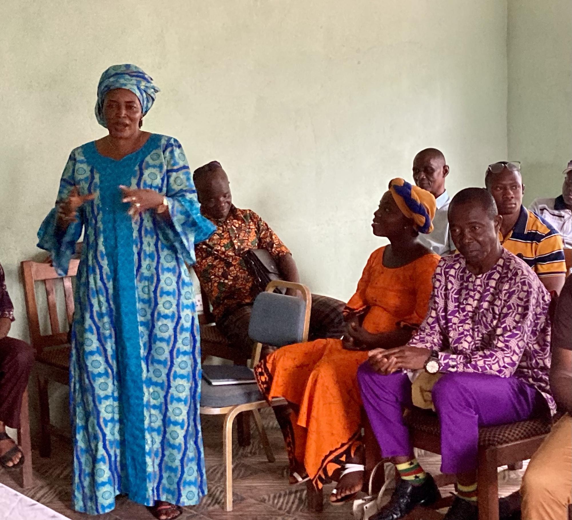 A woman speaks at a meeting regarding womens rights in Sierra Leone (Courtesy of Lucy Ellis).