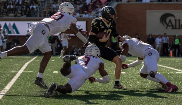 The Seminoles defense brings down Mitch Griffis. The Wake Forest quarterback was sacked four times on Saturday.