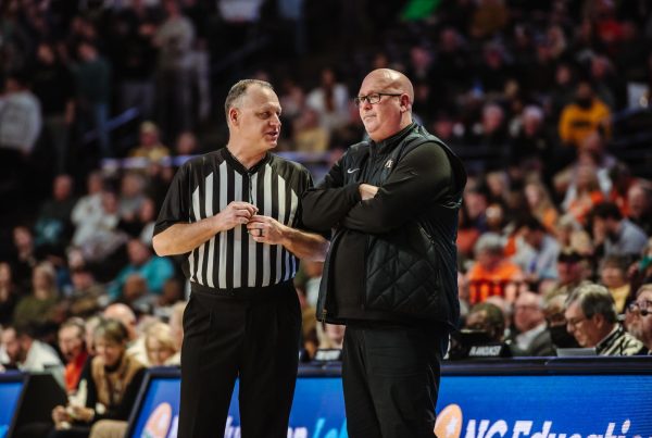 Head coach Steve Forbes speaks with a referee during a break in the Jan. 17, 2023, game against Clemson.