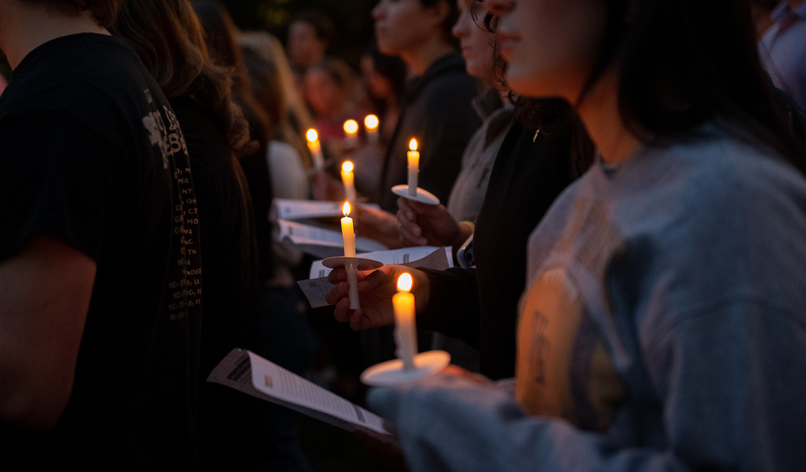 Students hold candles at Tuesday nights unity vigil.