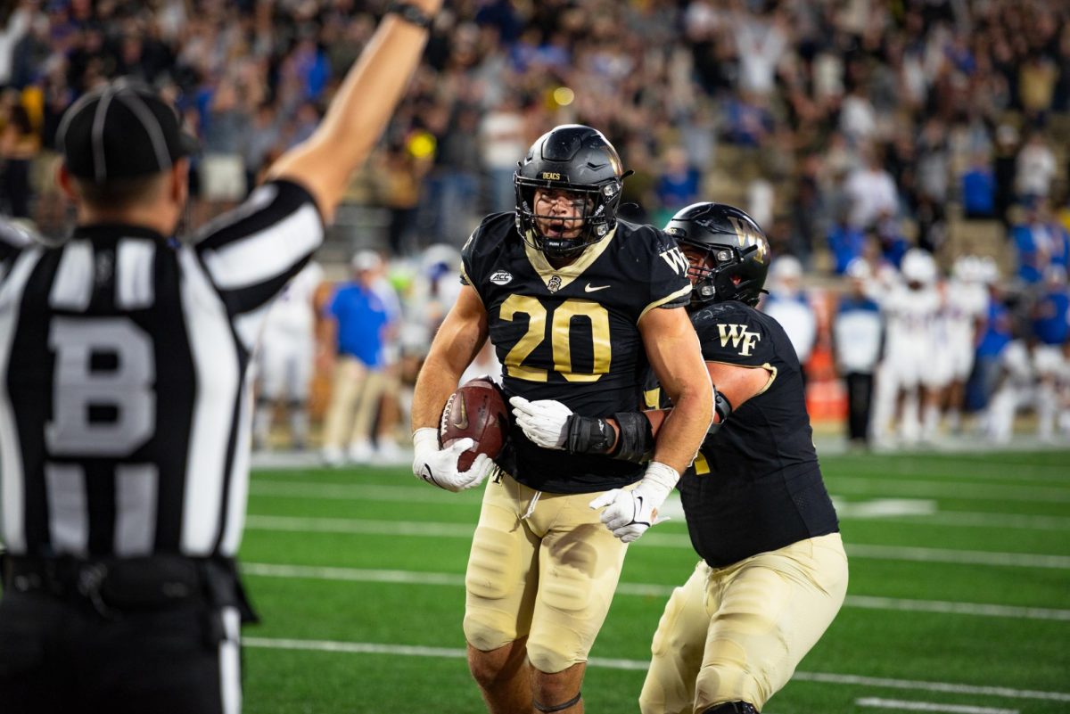 Junior Cameron Hite and Wake Forest celebrate their last second score to win the game 21-17.