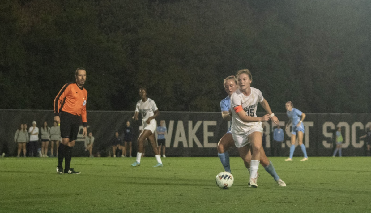 Emily Murphy dribbles the ball past the UNC defense in Wake Forest’s 1-1 draw Friday night.