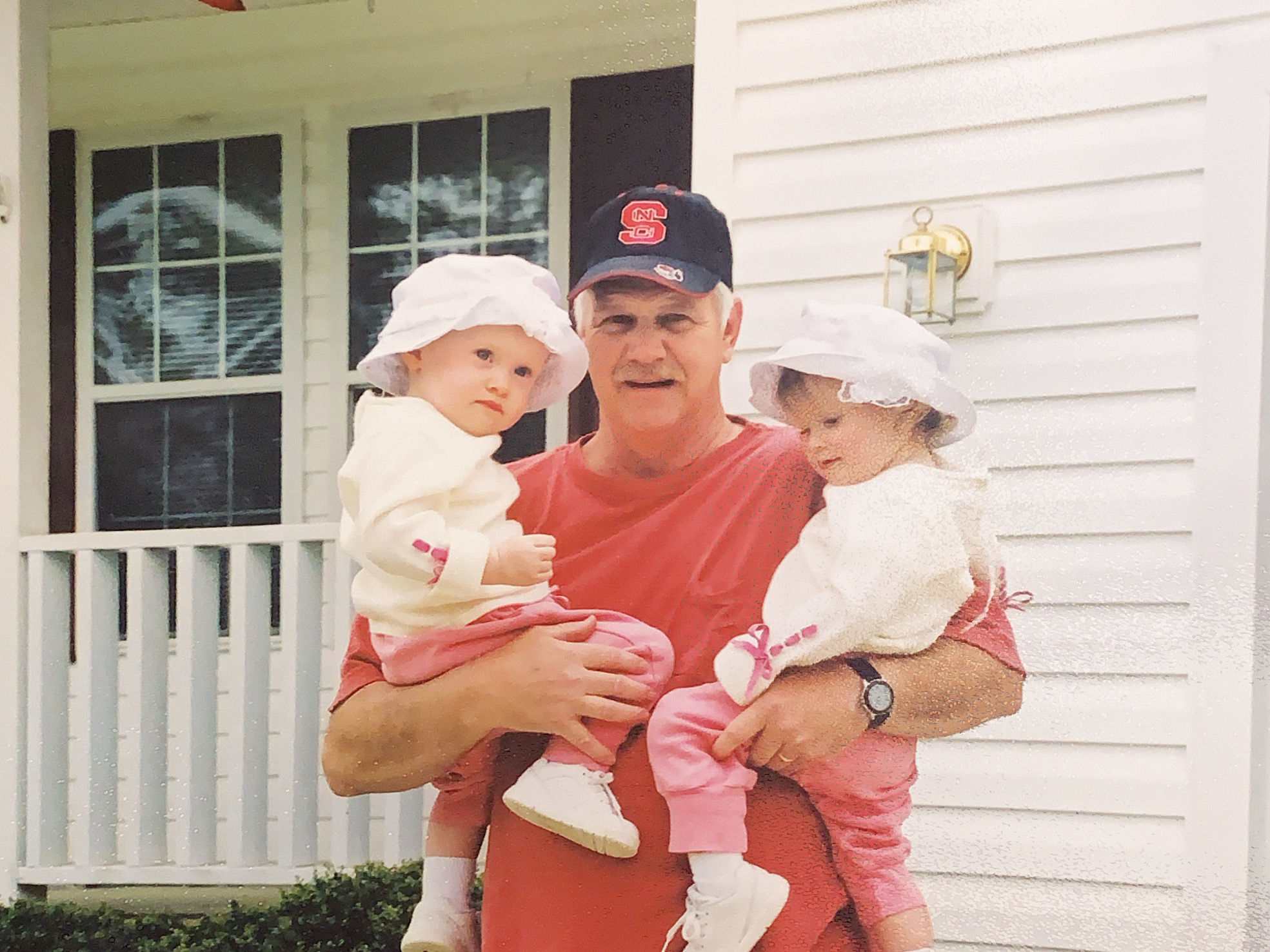 Jerome with his twin granddaughters, Christa Dutton (left) and Caroline Dutton (right).
