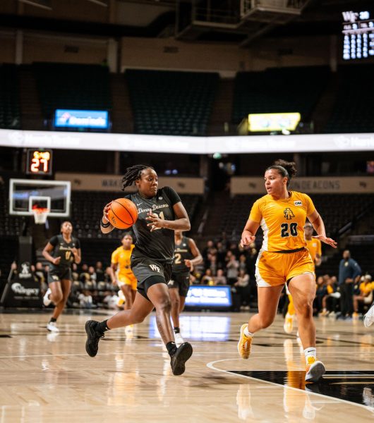 Senior guard Elise Williams drives to the basket against NC A&T. Williams finished the game with 7 points, 4 rebounds and 4 assists. (Courtesy of Wake Forest Athletics)