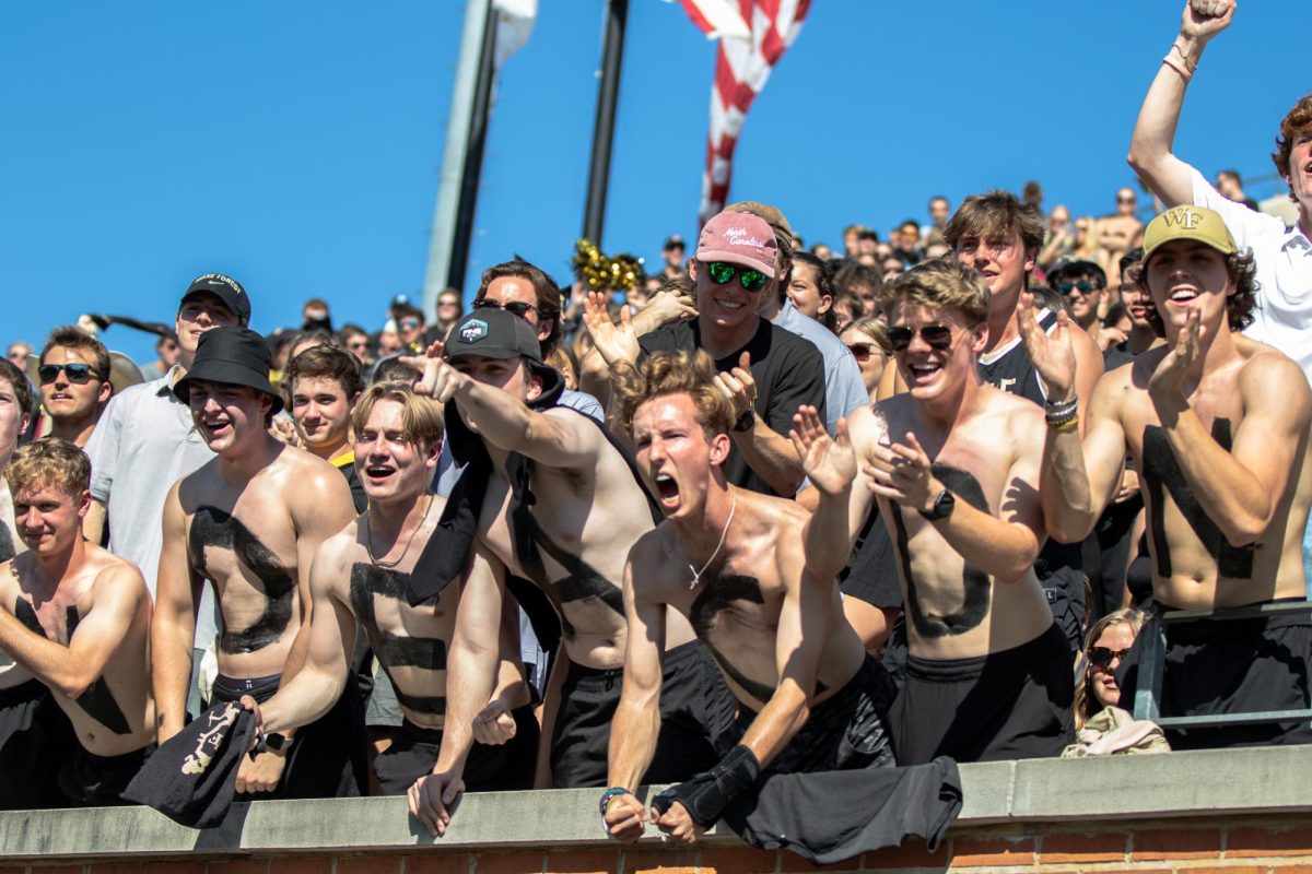 Wake Forest students paint their chests to cheer on the Demon Deacons during their 41-16 loss to No. 4 Florida State. (Oct. 28, 2023)