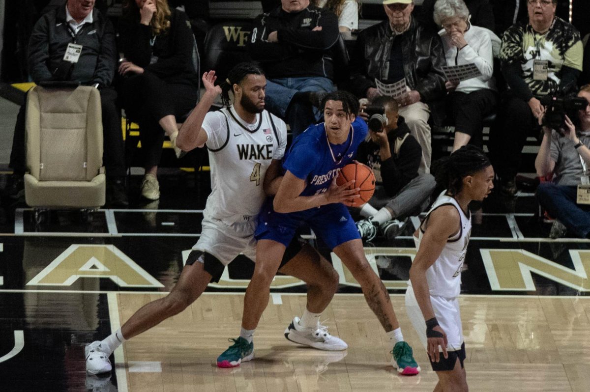 Efton Reid (No. 4) guards a Presbyterian player in Wake Forest’s 91-68 victory on Dec. 21, 2023.