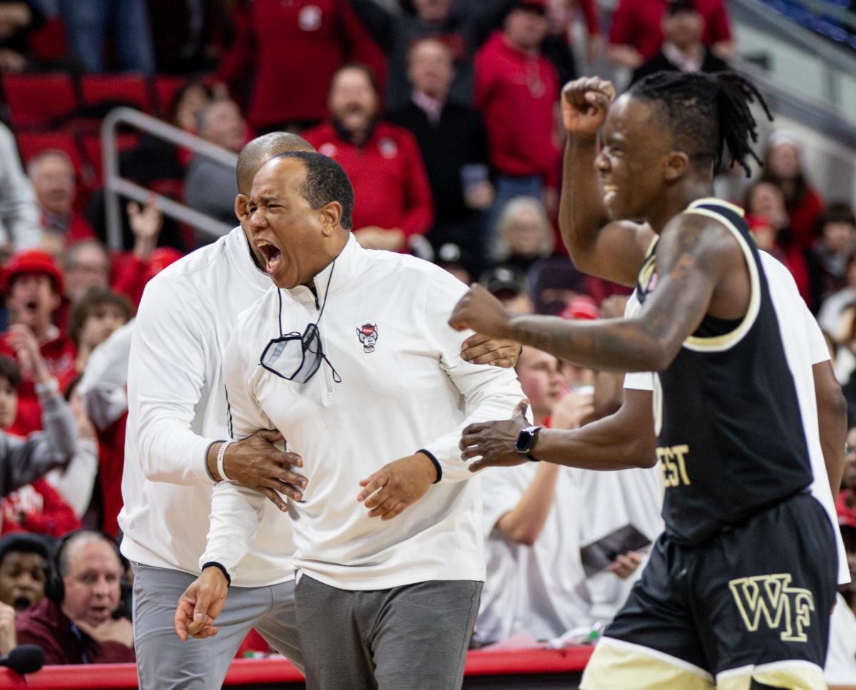 NC State Head Coach Kevin Keatts argues a call on the court.