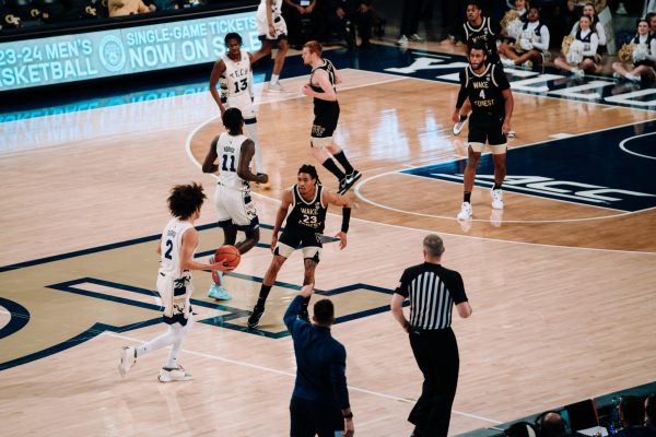 Wake Forest guard Hunter Sallis looks to defend Georgia Tech’s Naithan George. Sallis had ten points in the outing. (Courtesy of Wake Forest Athletics)