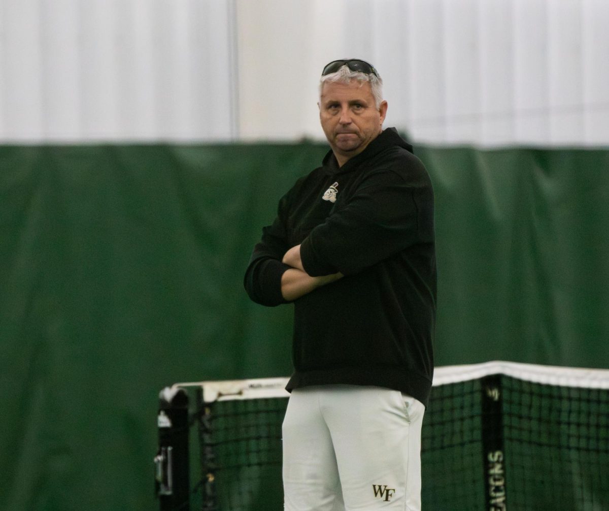 Head Men’s Tennis Coach Tony Bresky looks on during the Demon Deacons’ match versus No. 9 Columbia.