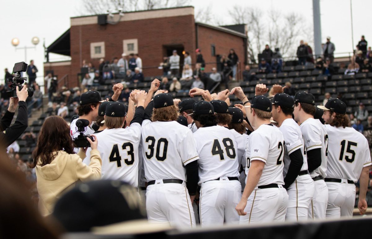 The Demon Deacons create a pregame huddle as they prepare to take on the Fordham Rams.
