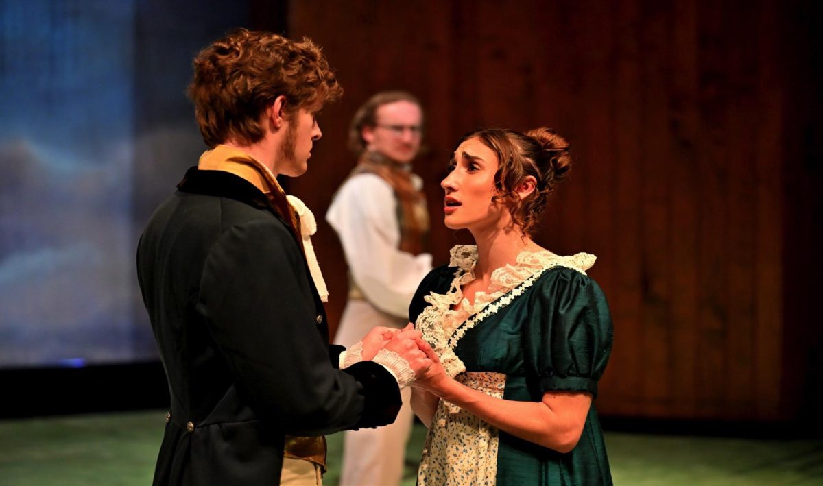 John and Fanny Dashwood, played by Bennett Haara and BG Cave, hold hands in the intimate setting of the Ring Theater as they share a tender moment at the crux of the performance.