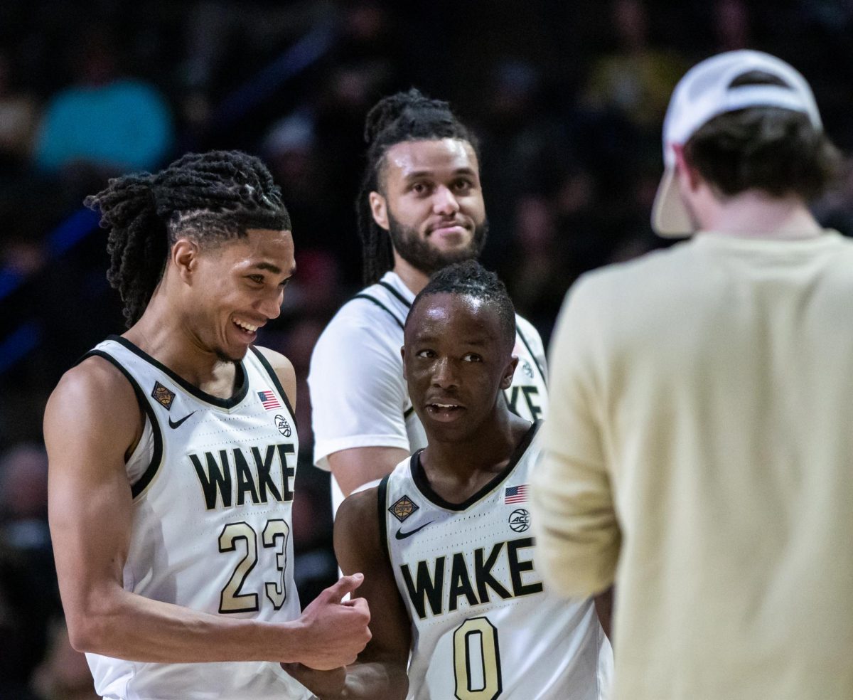Wake Forest’s Kevin “Boopie” Miller (0) is surrounded by teammates during the NIT first-round matchup against Appalachian State. Miller had a career-high 31 points on the night.