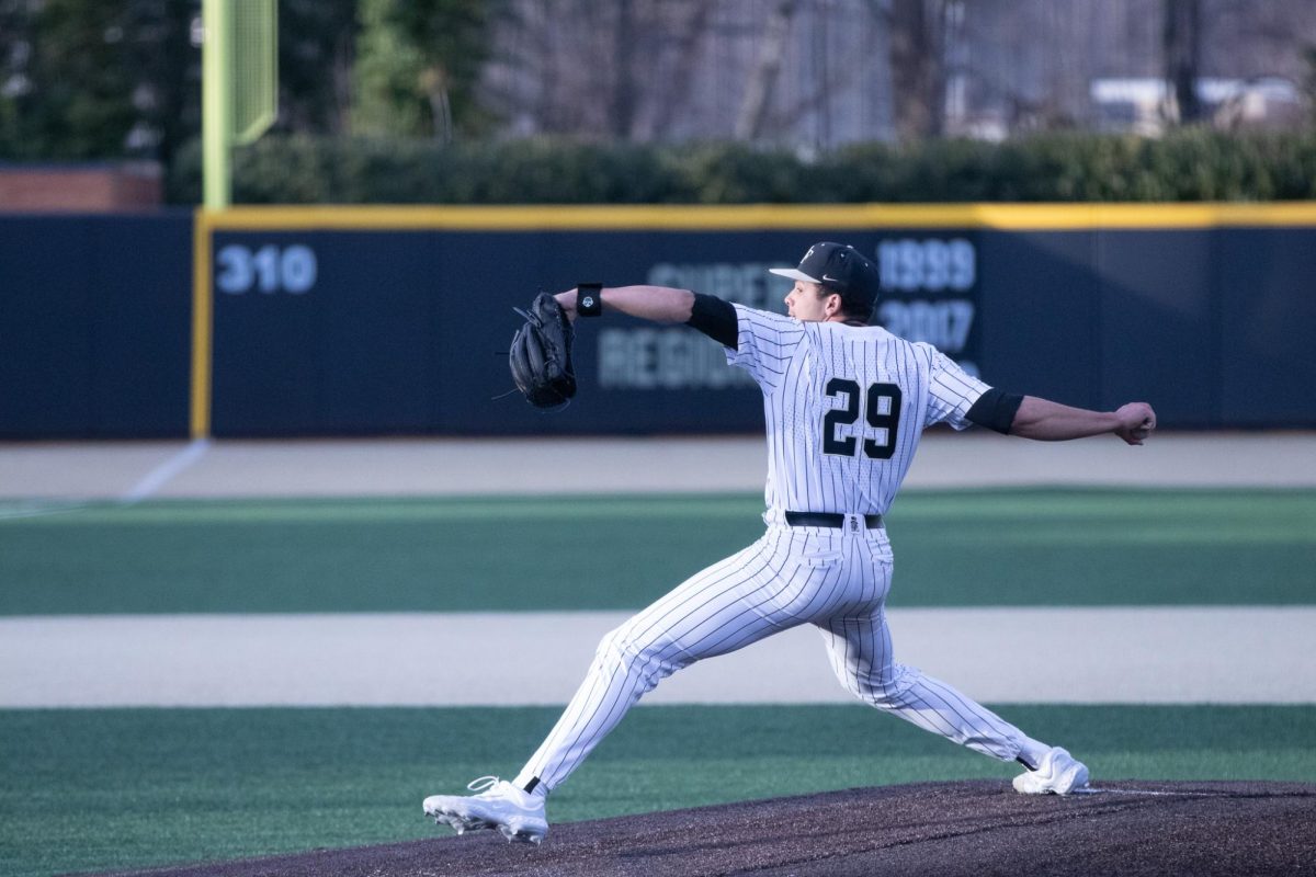 Wake+Forest+RHP+Chase+Burns+%2829%29+winds+up+at+the+mound+for+a+pitch+against+Dayton+on+Feb.+24.+Burns+pitched+12+strikeouts+against+Louisville+on+Friday.
