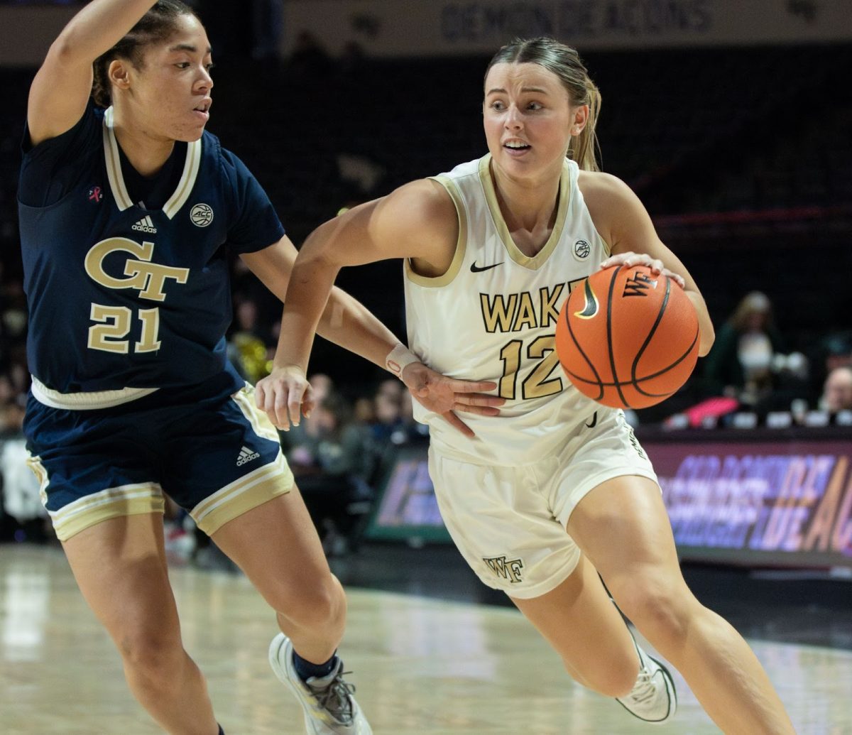 Guard Katie Deeble (12) drives past a Georgia Tech defender on February 4th. The freshman guard had a career-high 20 points in the Demon Deacons’ rematch with Georgia Tech this past week.