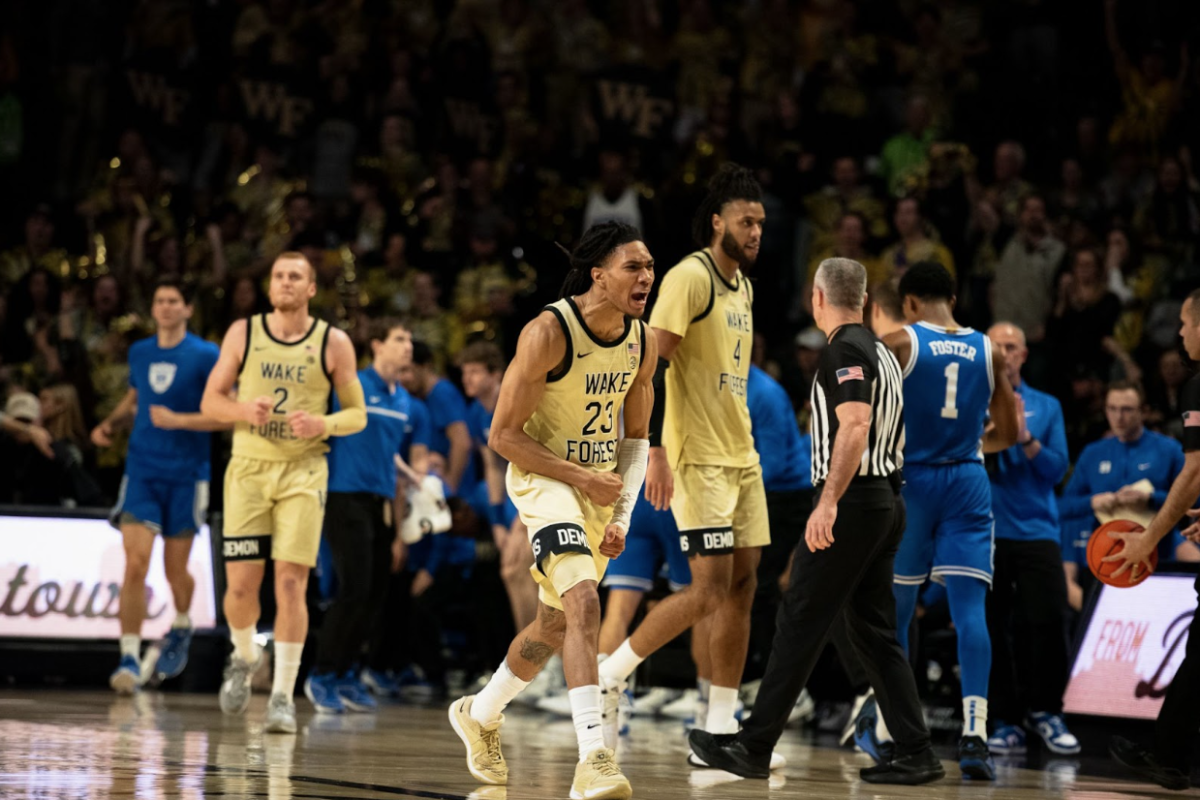 Hunter Sallis (23) celebrates after a shot from beyond the arc that forces a No. 9 Duke timeout during Wake Forest’s 83-79 upset win at home on Feb 24. 