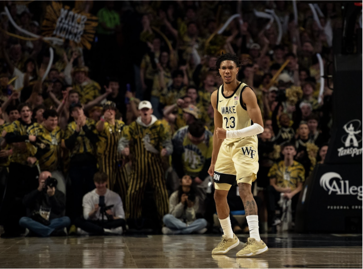Hunter Sallis (23) celebrates a clutch 3-pointer to put the Demon Deacons ahead in their 83-79 win over No. 8 Duke on Feb. 24.
