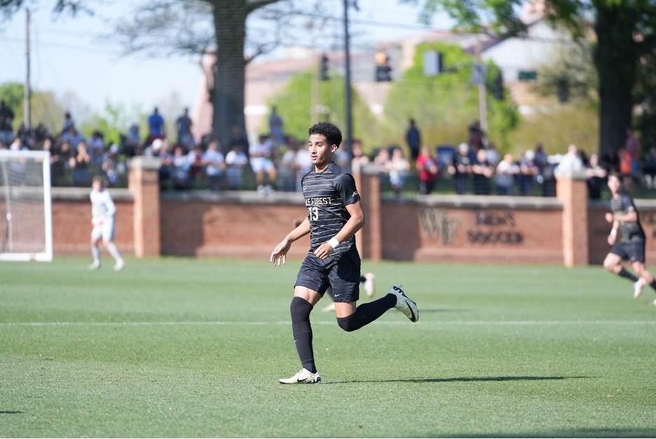 Wake Forest Jeffrey White (13) looks onto the field during the Spring Soccer Cup’s title match. White recorded one assist this weekend against Garner-Webb.