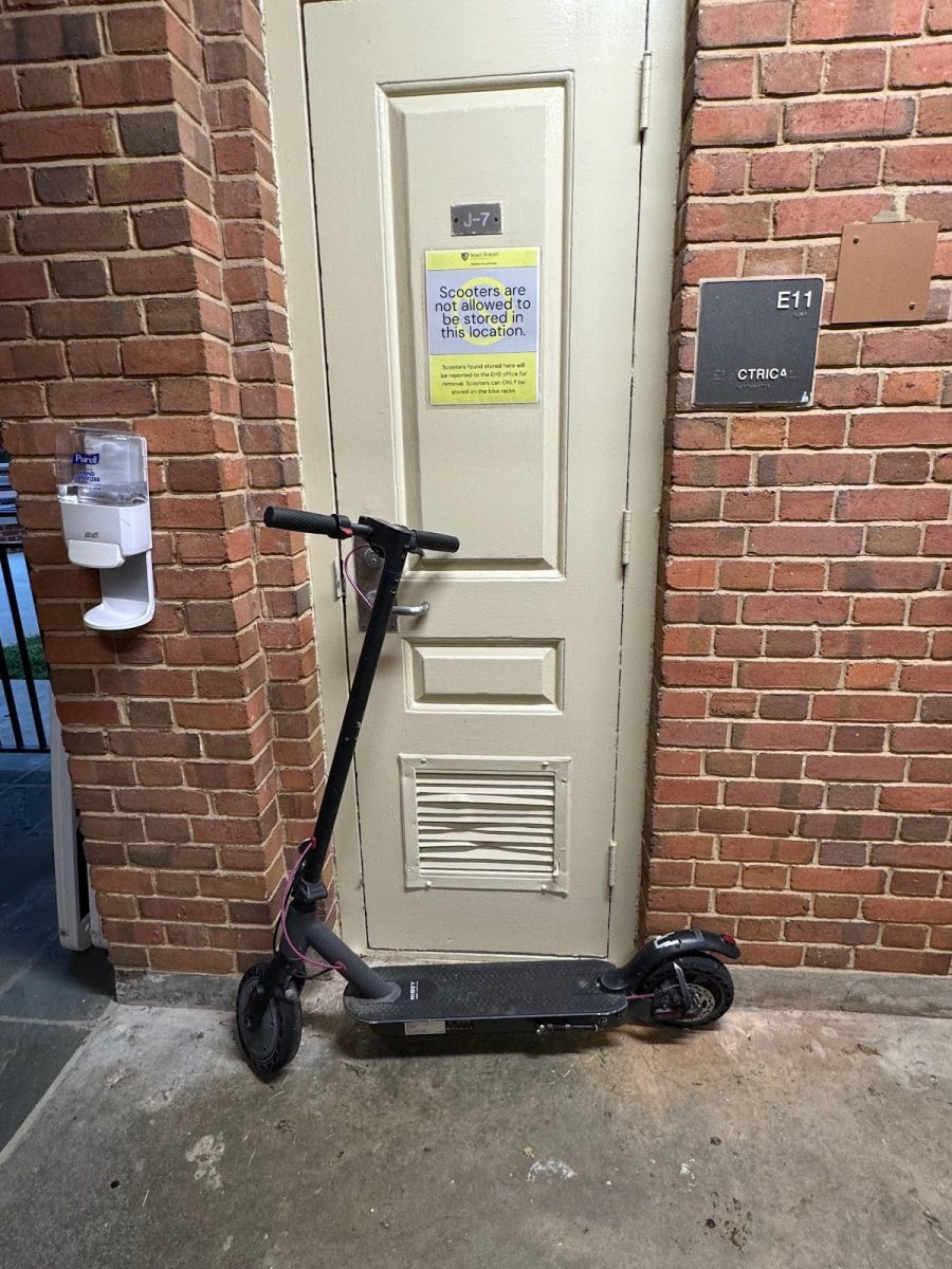 A scooter sits outside of Davis Residence Hall.