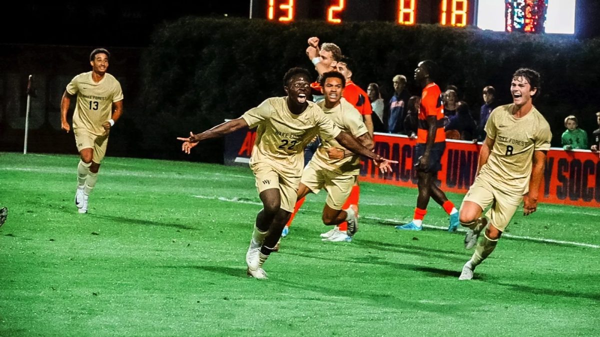 Wake Forest’s Basit Umar (22) celebrates his goal in the final minutes to seal victory in this weekend's match against Syracuse. (Courtesy of Wake Forest Athletics)