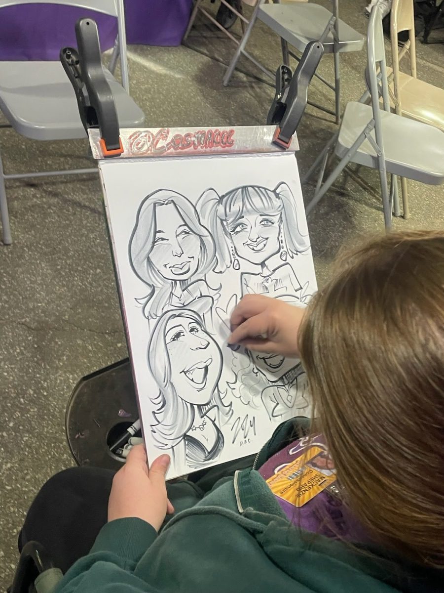 Lovely caricature artist drawing up a nice little hyperbolic renderings of my friends and I