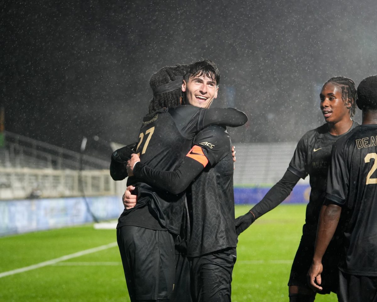 Cooper Flax (18) celebrates his second goal with Prince Amponsah (27).