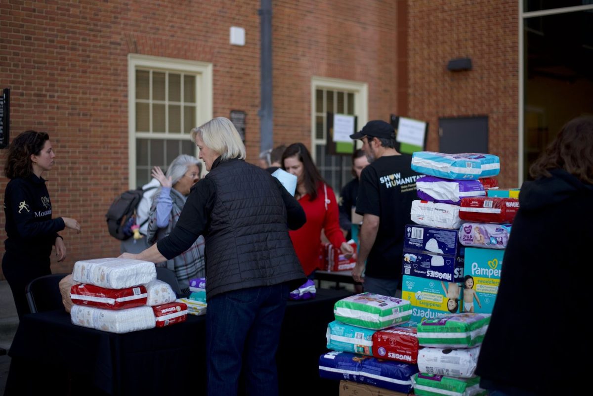 On Saturday, Nov. 16 volunteers including Wake Forest University President Dr. Susan Wente packaged food, diapers and pet food to be sent to western North Carolina.