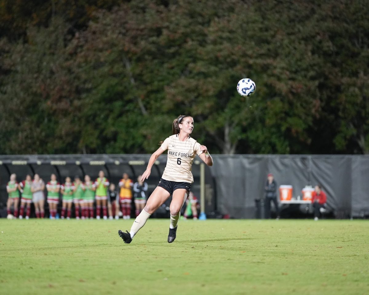 Sophomore midfielder Dempsey Brown (6) chases after a loose ball in the first half of Thursday evening’s match against NC State.