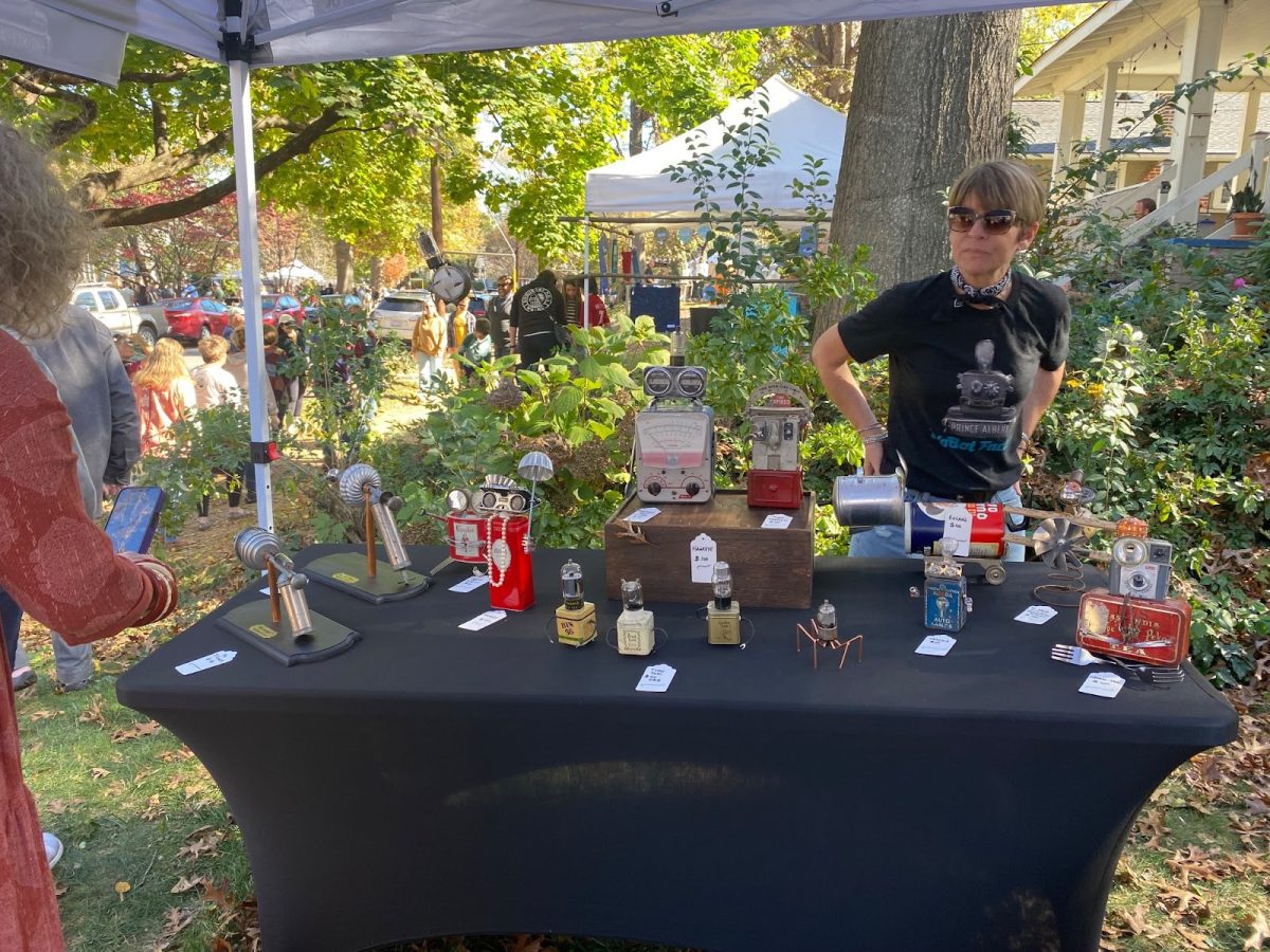 Mark Wojchick, the WoBot Creators's table, being overseen by his wife.