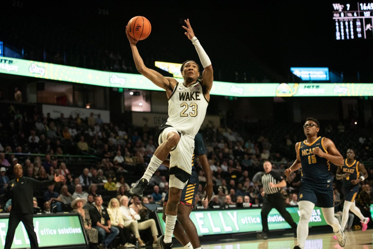 Hunter Sallis (23) goes up for a dunk, one of his four baskets from the field on the day. Sallis also led the team in assists for the second straight outing.