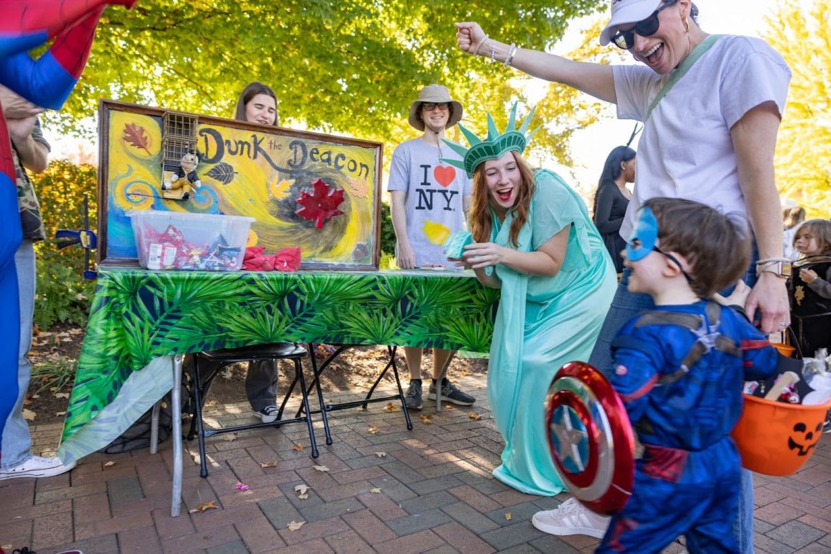 Children visit “wild adventures” themed booths set up by campus organizations.
