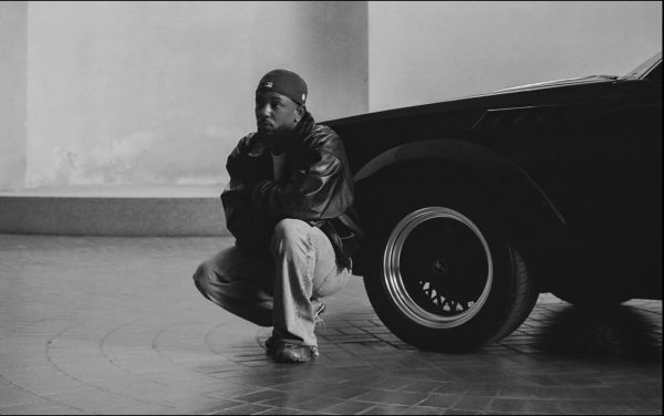 Kendrick Lamar poses in front of a GNX, the legendary car from which his album gets its title. (Courtesy of Rolling Stone)