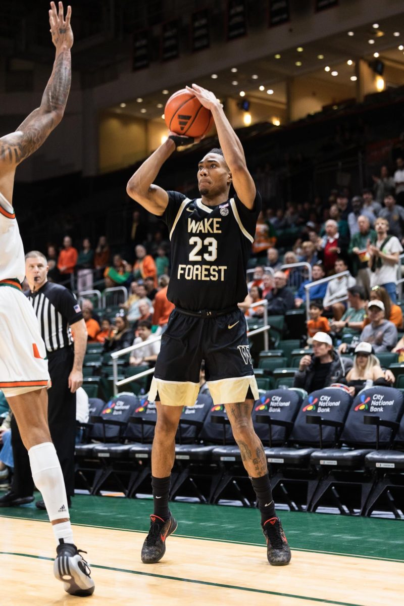 Hunter Sallis (23) shoots a three-pointer.