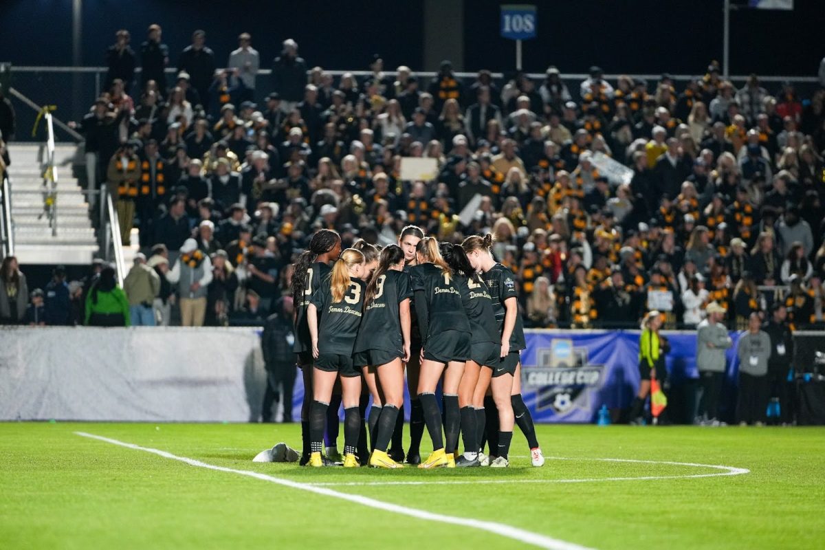 Wake Forest starters huddle prior to kickoff in the national championship match against North Carolina on Dec. 9.